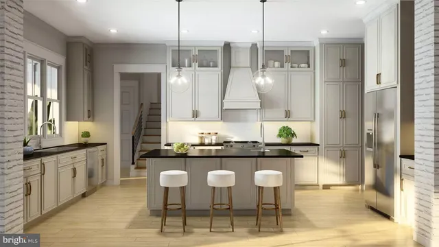 a kitchen with stainless steel appliances granite countertop a kitchen island a stove and a cabinets