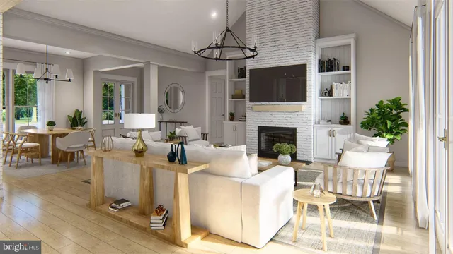 a living room with fireplace a chandelier and a flat screen tv