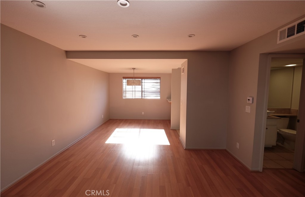 249 Alpine Street, Unit 57 Pasadena, CA 91106 - Photo 2 of 29 a view of wooden floor and windows in a room
