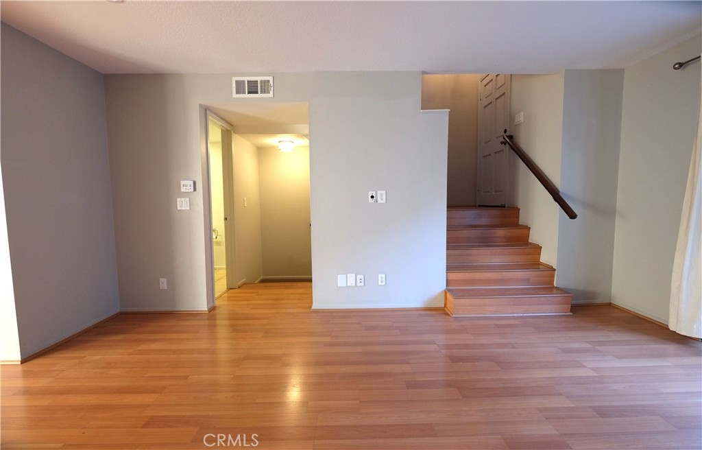 249 Alpine Street, Unit 57 Pasadena, CA 91106 - Photo 21 of 29 a view of entryway with wooden floor