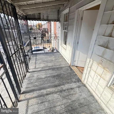 a view of a porch with wooden floor and outdoor space