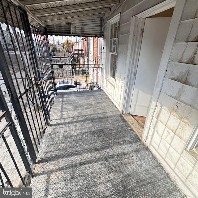 2891 Pelham Avenue Baltimore, MD 21213 - Photo 11 of 11 a view of a porch with wooden floor and outdoor space