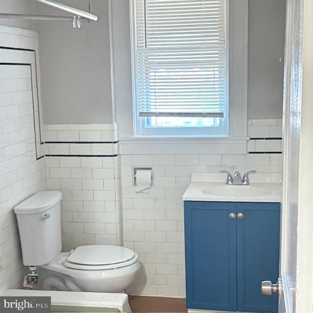 2891 Pelham Avenue Baltimore, MD 21213 - Photo 3 of 11 a bathroom with a toilet a sink and a window