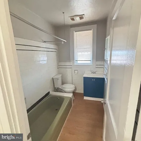 a bathroom with a toilet a sink and a shower