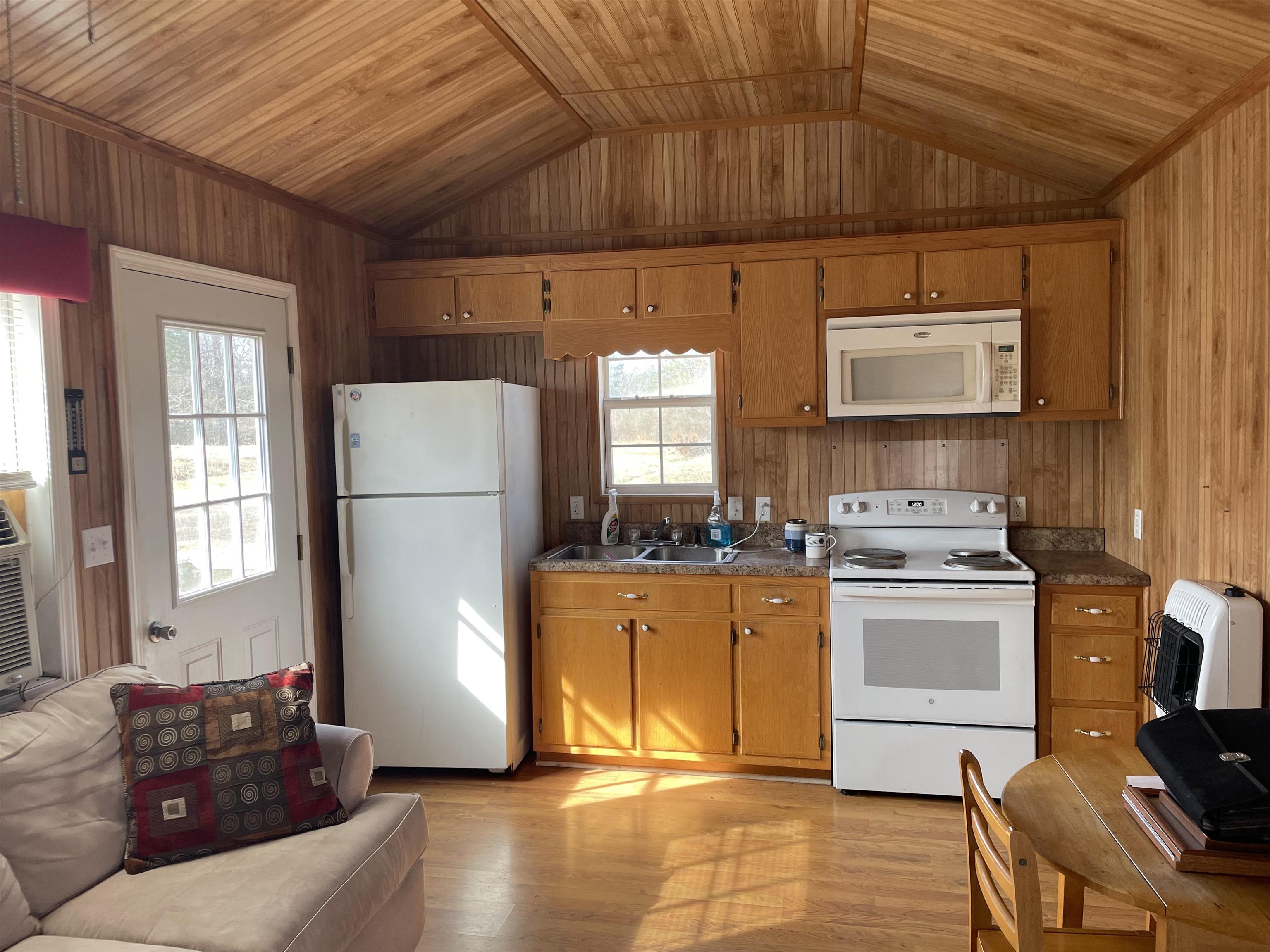 4130 Henderson Road Sardis, TN 38371 - Photo 2 of 14 a kitchen with a refrigerator and a stove