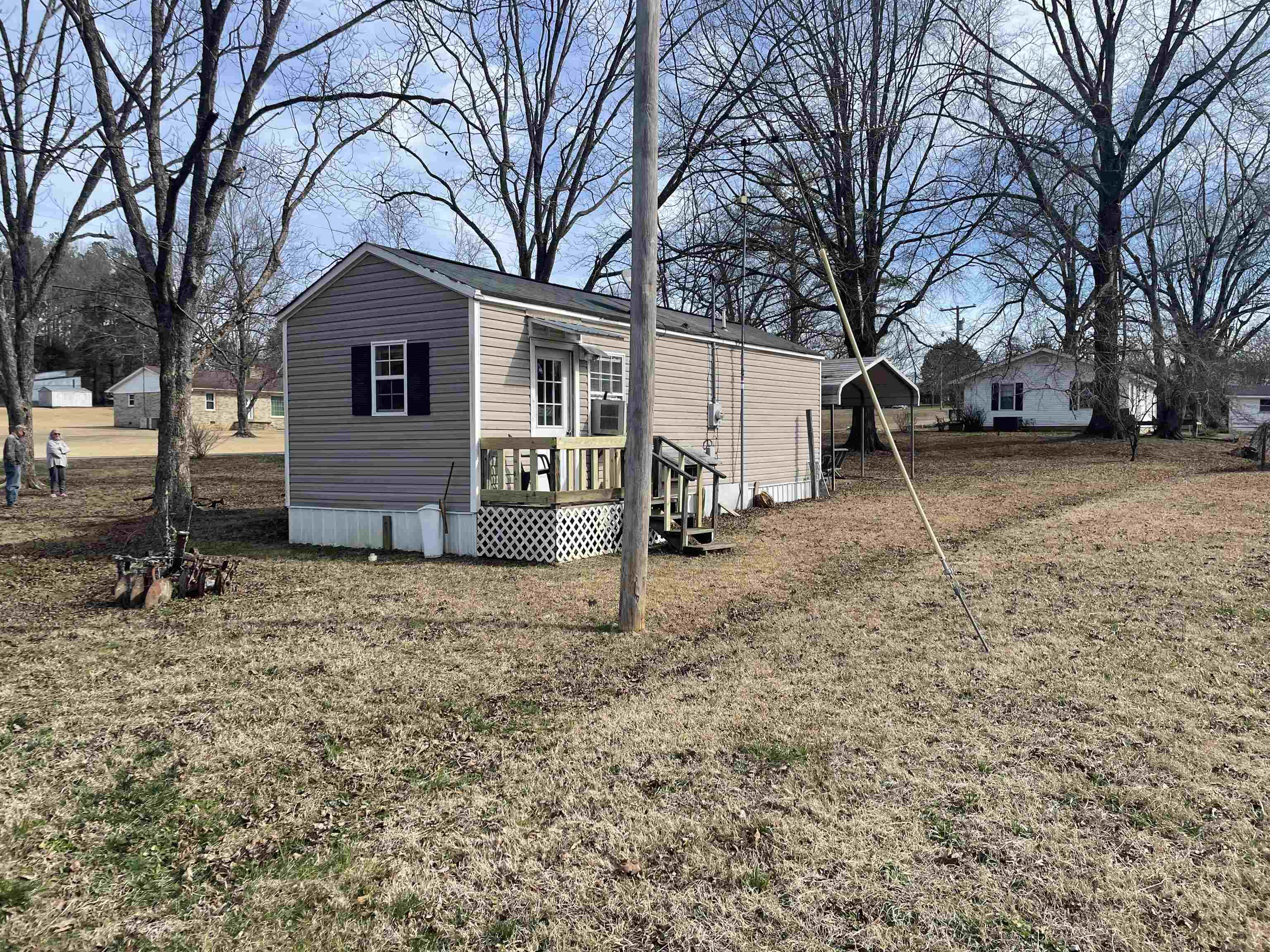 4130 Henderson Road Sardis, TN 38371 - Photo 9 of 14 a view of a house with a yard