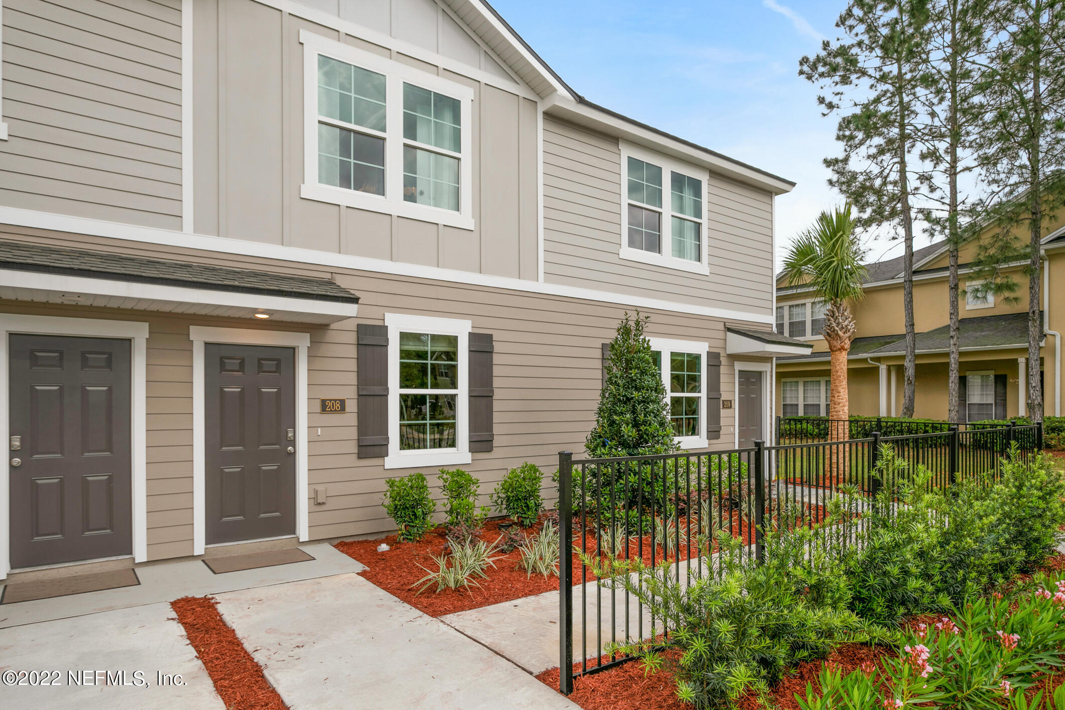 8312 Zenith Circle Jacksonville, FL 32256 - Photo 1 of 25 front view of a house with a porch