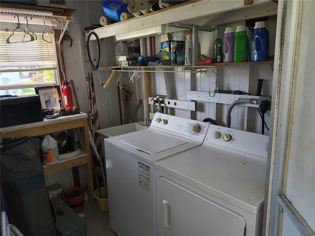 a utility room with dryer and washer
