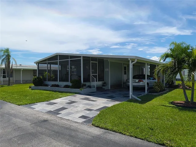 a front view of a house with a yard and porch
