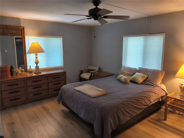 a bedroom with a bed and a dresser