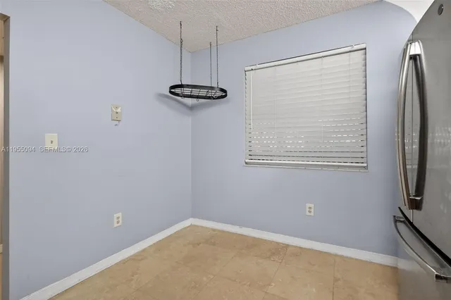 an empty room with closet area
