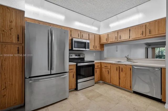 a kitchen with cabinets and a sink