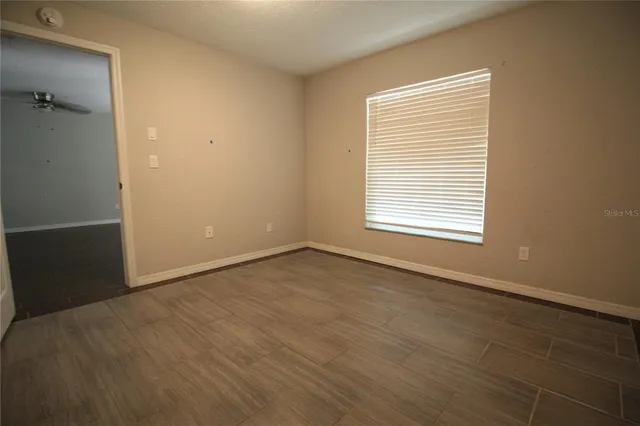 a view of an empty room with a window