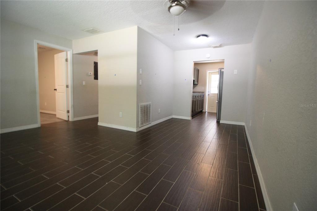6101 Southeast Foss Road, Unit 4 Belleview, FL 34420 - Photo 15 of 19 a view of a hallway with wooden floor