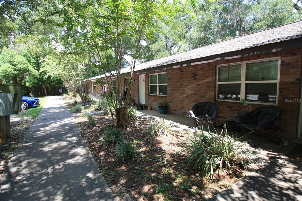 6101 Southeast Foss Road, Unit 4 Belleview, FL 34420 - Photo 19 of 19 a backyard of a house with yard and outdoor seating