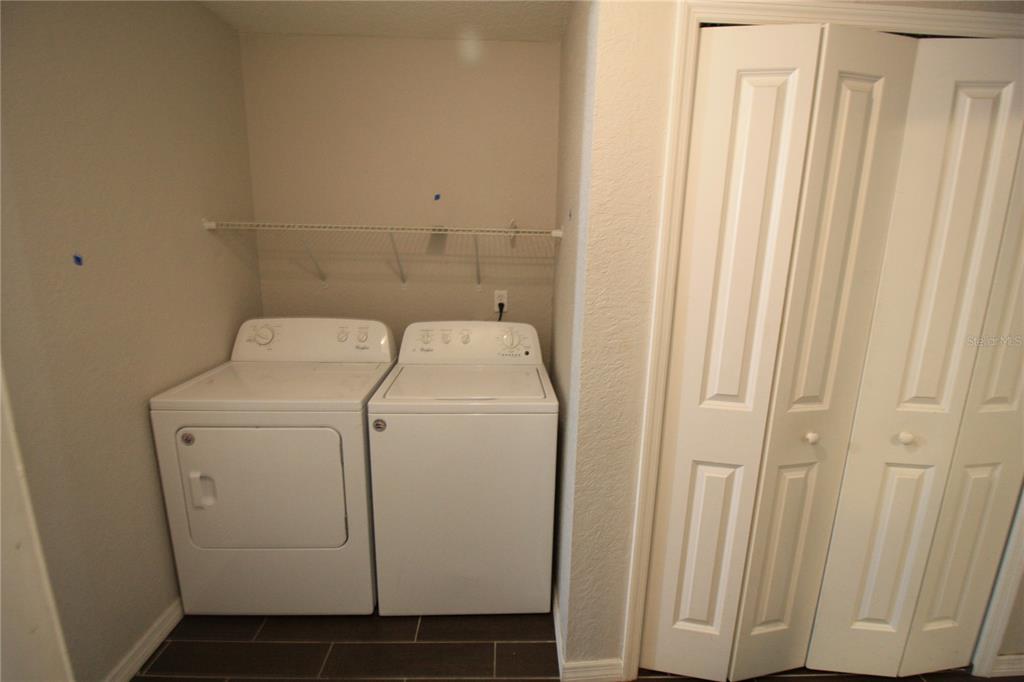 6101 Southeast Foss Road, Unit 4 Belleview, FL 34420 - Photo 5 of 19 a utility room with dryer and washer