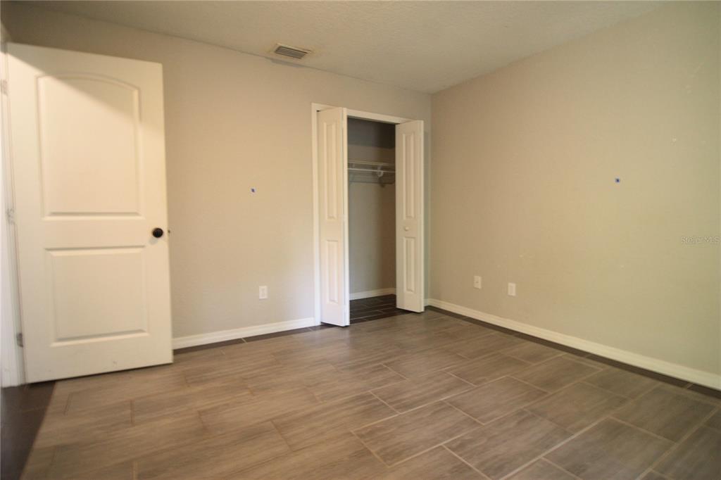 6101 Southeast Foss Road, Unit 4 Belleview, FL 34420 - Photo 7 of 19 a view of an empty room with closet area