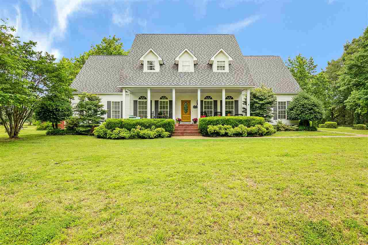 1065 Walnut Hill Church Road Bells, TN 38006 - Photo 1 of 1 a front view of a house with garden
