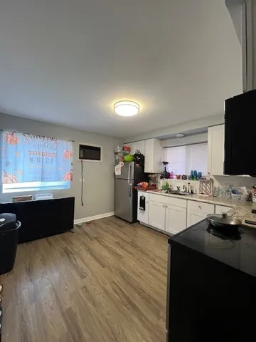 a kitchen with cabinets a sink and appliances