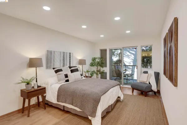 a bedroom with a bed and a couch