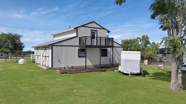 a view of a back yard of the house