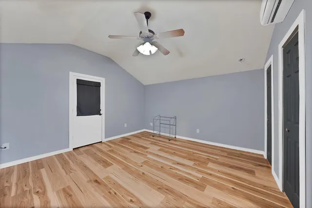 a bathroom with a shower and a sink