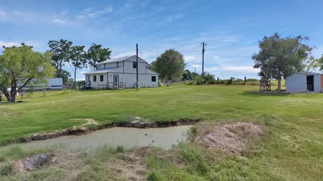 a bedroom with a bed and a table