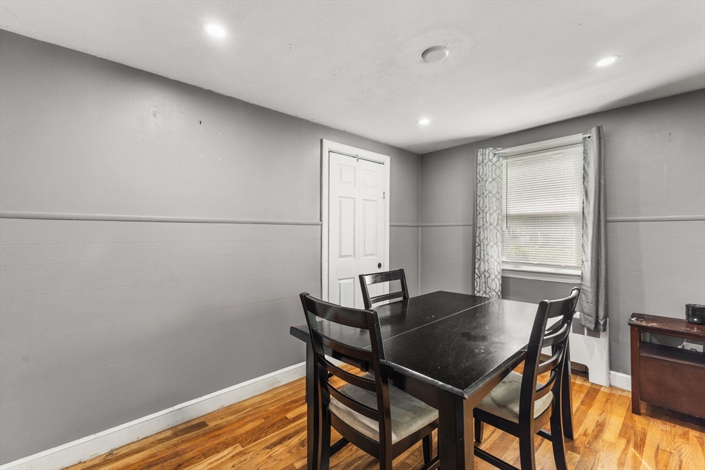 28 Maple Circle Randolph, MA 02368 - Photo 13 of 24 a view of a dining room with furniture and wooden floor