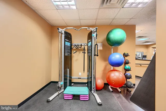 a room with a mirror and fan