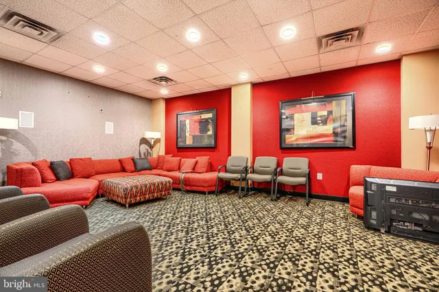 a bedroom with furniture and a rug