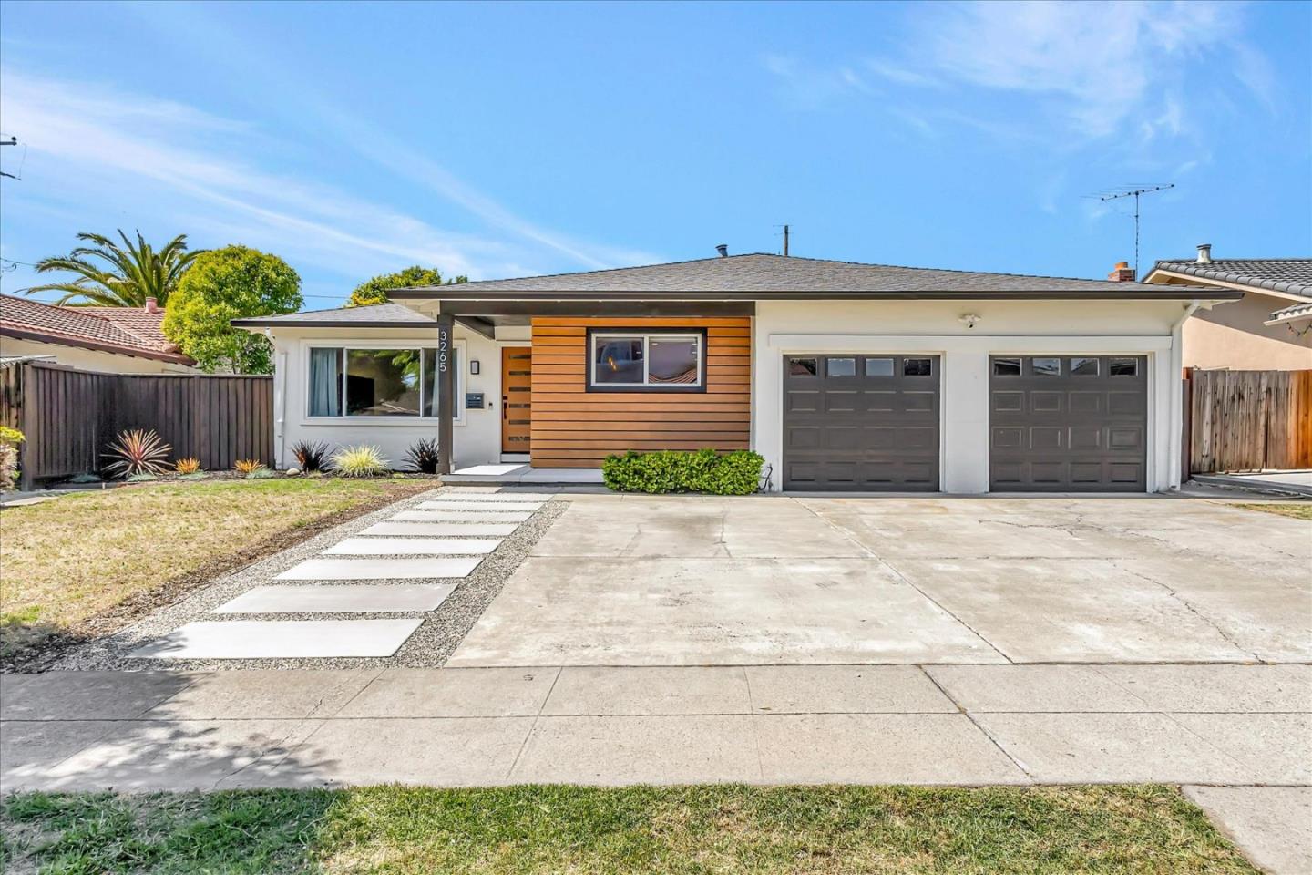 3265 Floresta Drive San Jose, CA 95148 - Photo 1 of 51 a front view of a house with a yard and potted plants