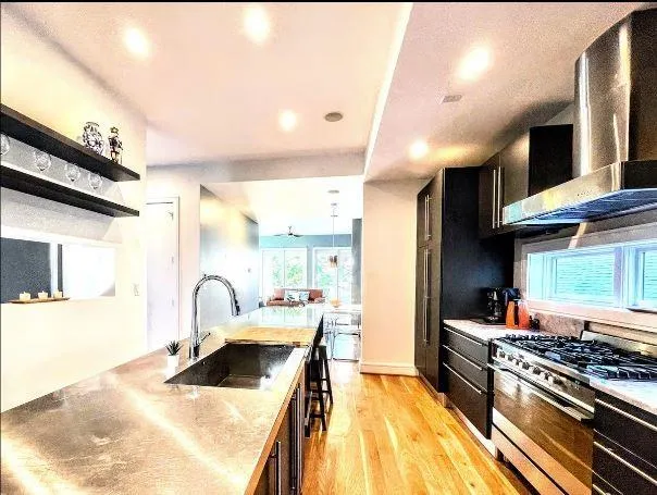 a bathroom with a granite countertop tub sink and mirror