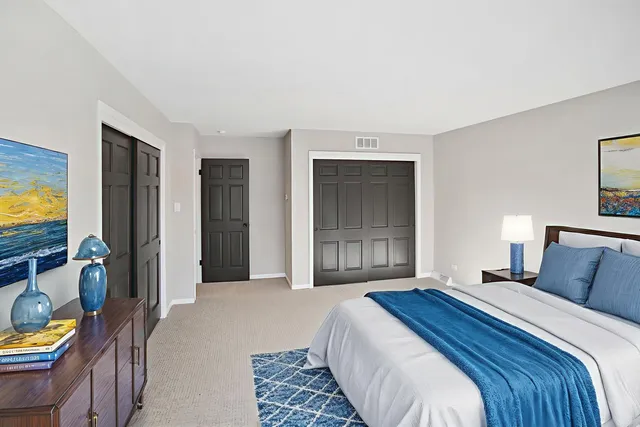 a bedroom with bed and window