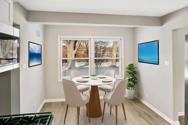 a dining room with furniture and window