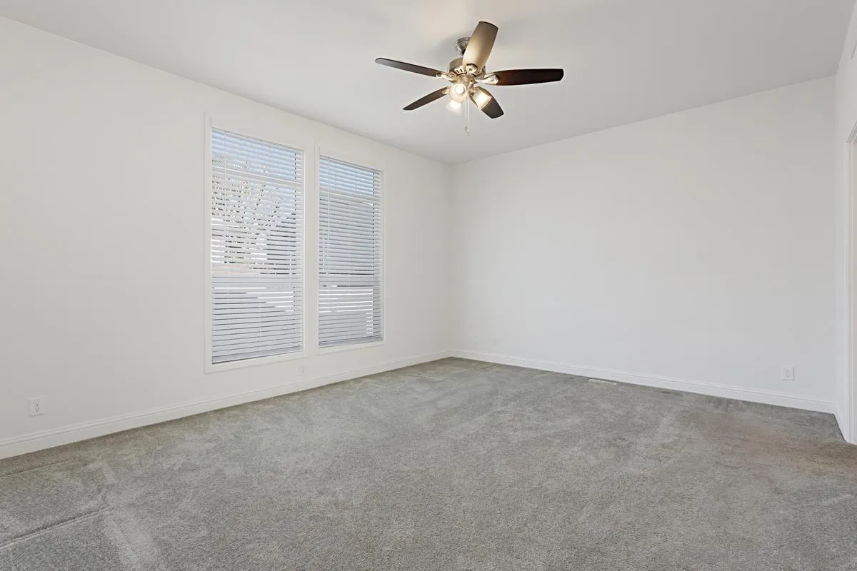 13335 Buena Vista Poway, CA 92064 - Photo 16 of 26 an empty room with windows and chandelier fan