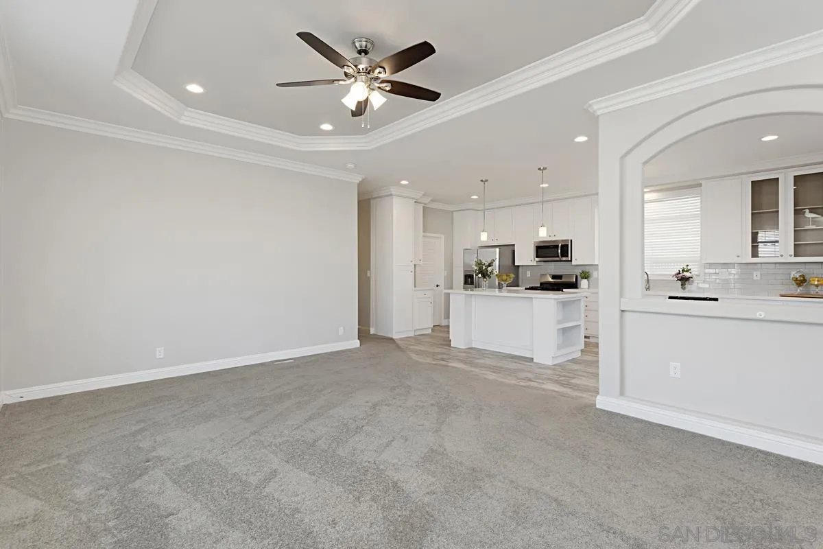 13335 Buena Vista Poway, CA 92064 - Photo 7 of 26 a view of a kitchen with a sink and dishwasher a refrigerator with white cabinets