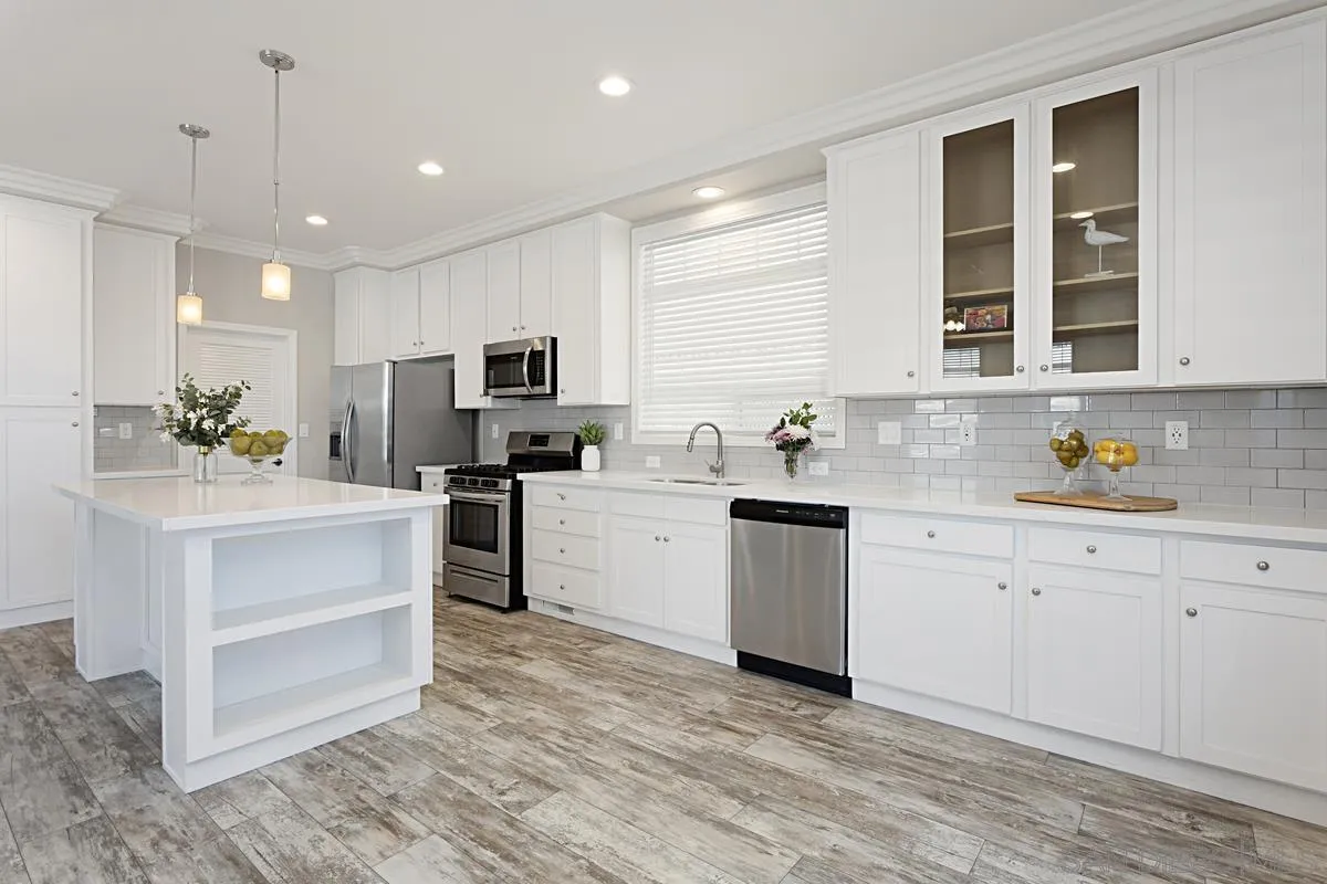 13335 Buena Vista Poway, CA 92064 - Photo 10 of 26 a kitchen with white cabinets and appliances