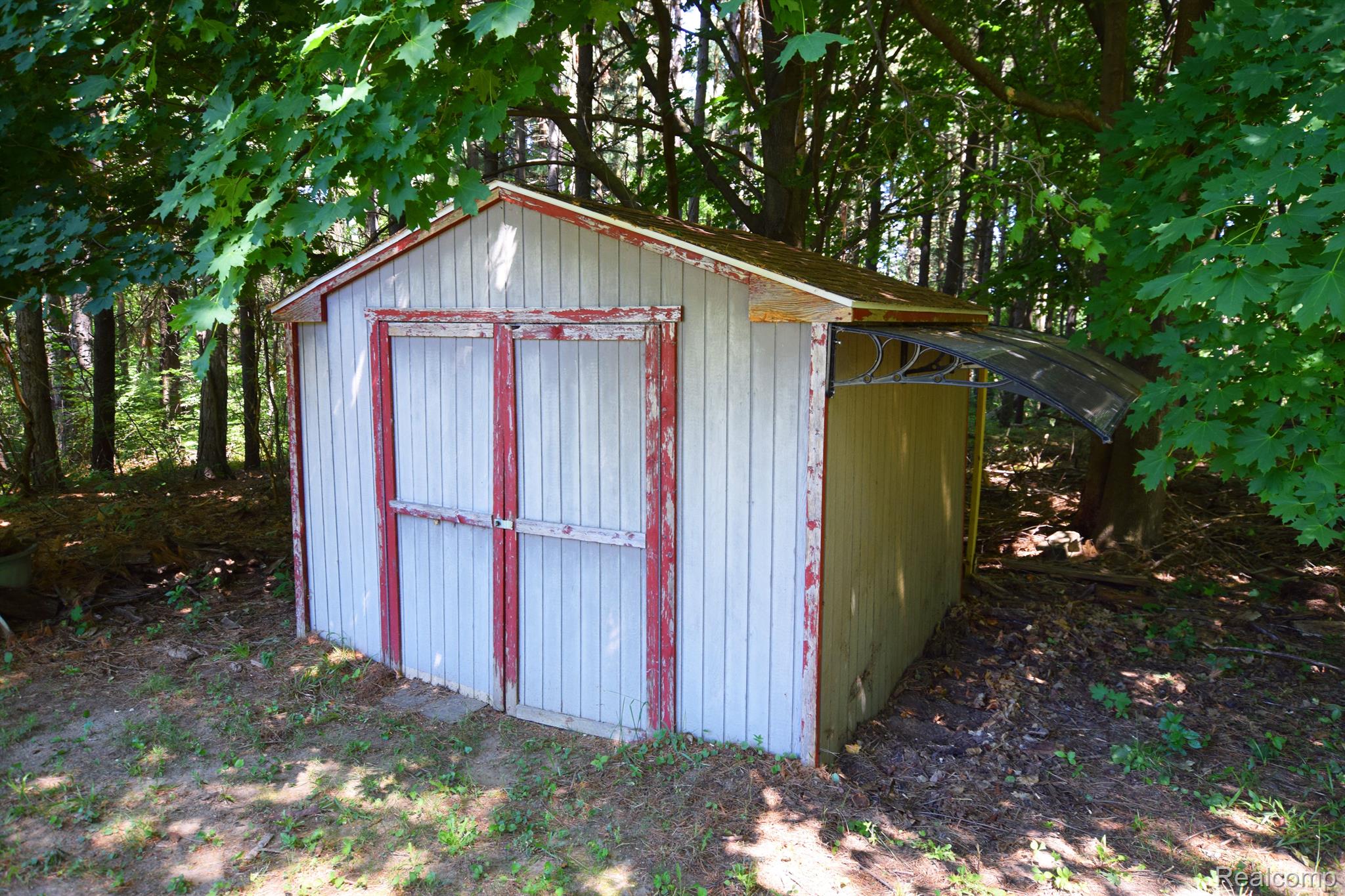 8087 East Carpenter Road Davison, MI 48423 - Photo 38 of 40 Two sheds, this ones great for your lawn games