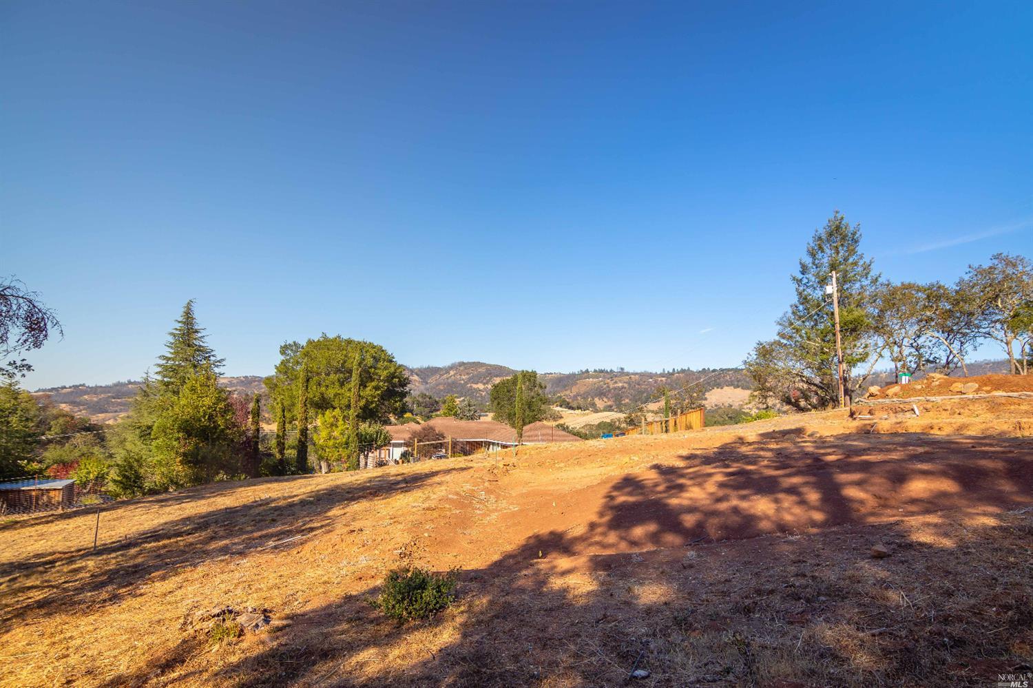4985 Pinecroft Way Santa Rosa, CA 95404 - Photo 1 of 1 a view of a yard with mountains in the background
