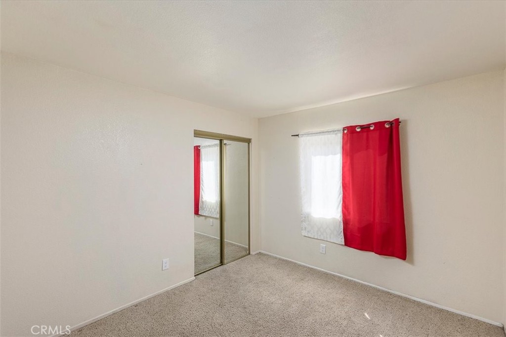 43115 Corte Landeros Temecula, CA 92592 - Photo 15 of 42 an empty room with red walls and closet