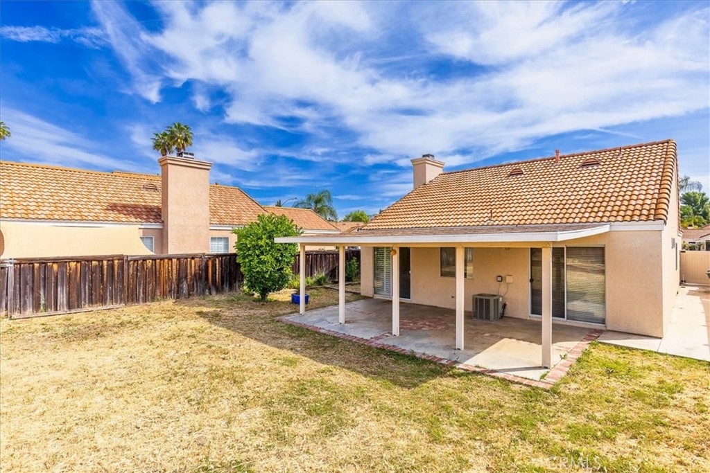 43115 Corte Landeros Temecula, CA 92592 - Photo 21 of 42 a view of a house with a patio and wooden fence