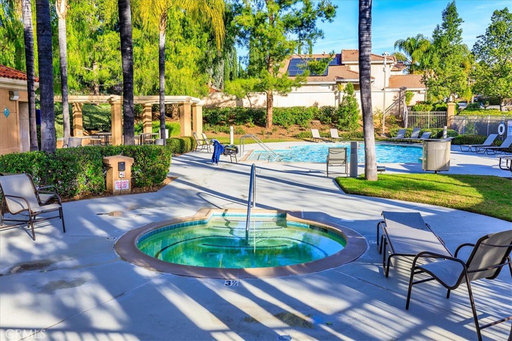 43115 Corte Landeros Temecula, CA 92592 - Photo 30 of 42 a view of a swimming pool with a patio