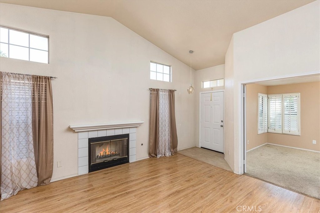 43115 Corte Landeros Temecula, CA 92592 - Photo 6 of 42 a view of an empty room with window and wooden floor