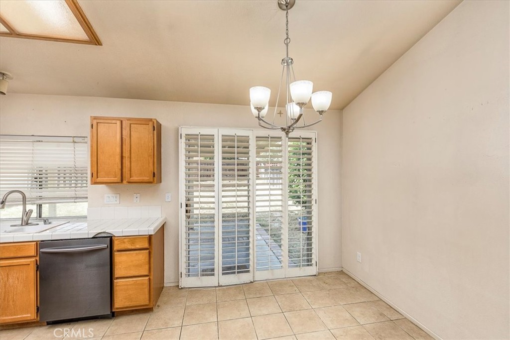 43115 Corte Landeros Temecula, CA 92592 - Photo 8 of 42 a view of a kitchen with a sink and dishwasher a kitchen view