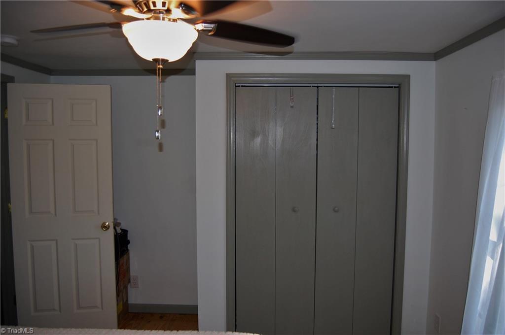 1395 Smothers Road Madison, NC 27025 - Photo 14 of 25 Bedroom number 2 closet with lots of room to tuck your dresser in.
