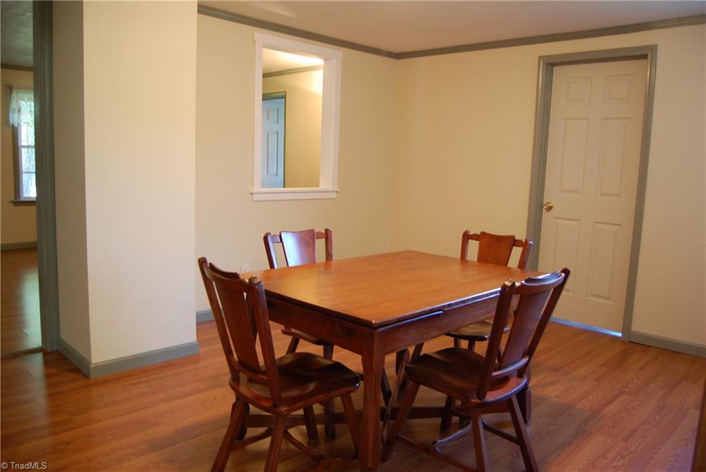 1395 Smothers Road Madison, NC 27025 - Photo 16 of 25 Very large dinning room with great access to the living areas and kitchen.