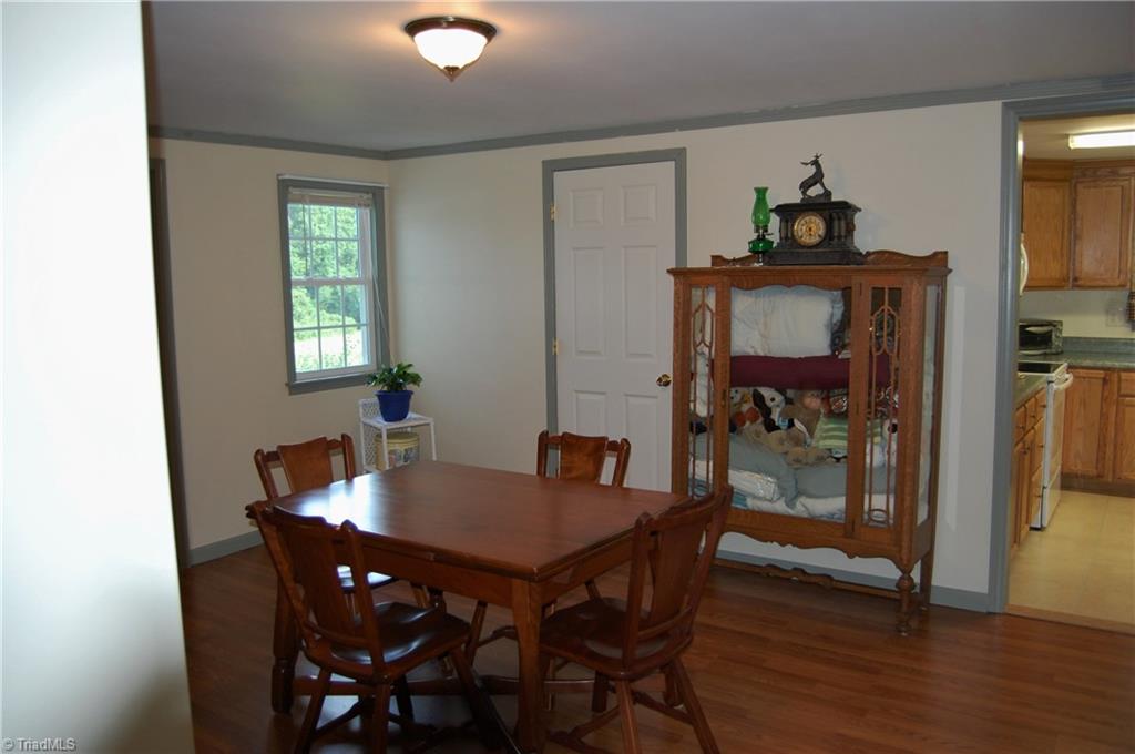 1395 Smothers Road Madison, NC 27025 - Photo 17 of 25 Second view of the dinning room with access to the large kitchen and bathroom.