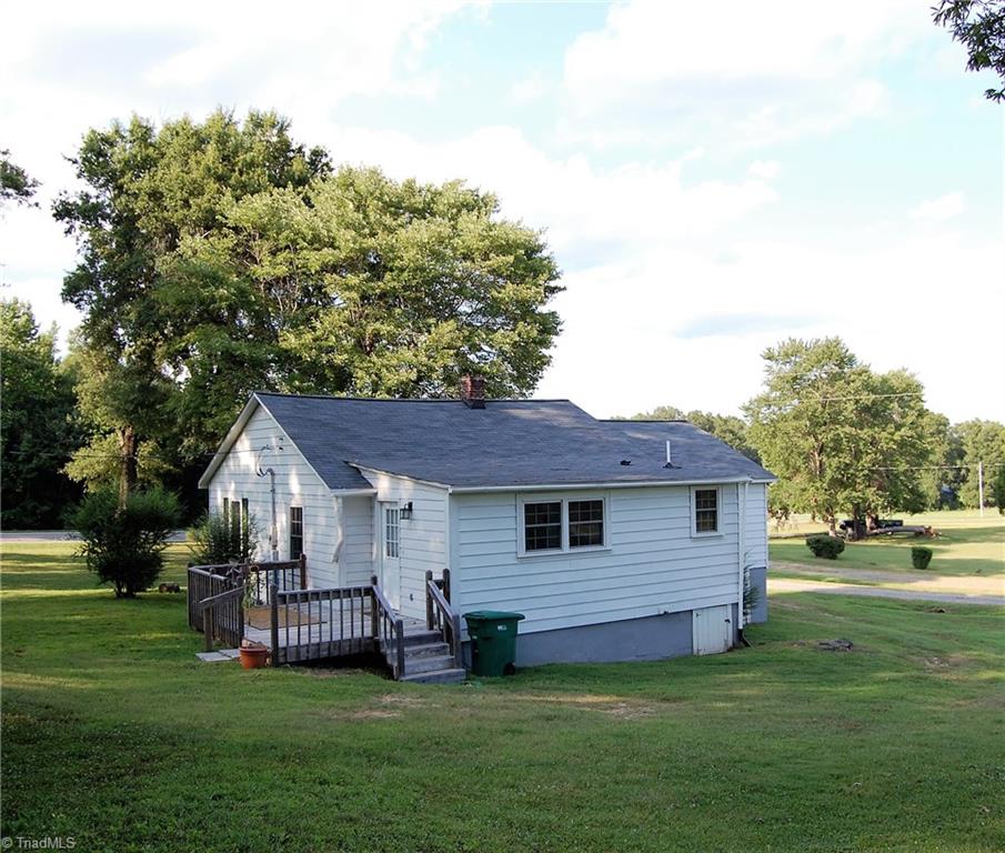 1395 Smothers Road Madison, NC 27025 - Photo 5 of 25 Wide angle view of the rear of the home and back porch.
