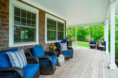 a outdoor living space with furniture and a yard