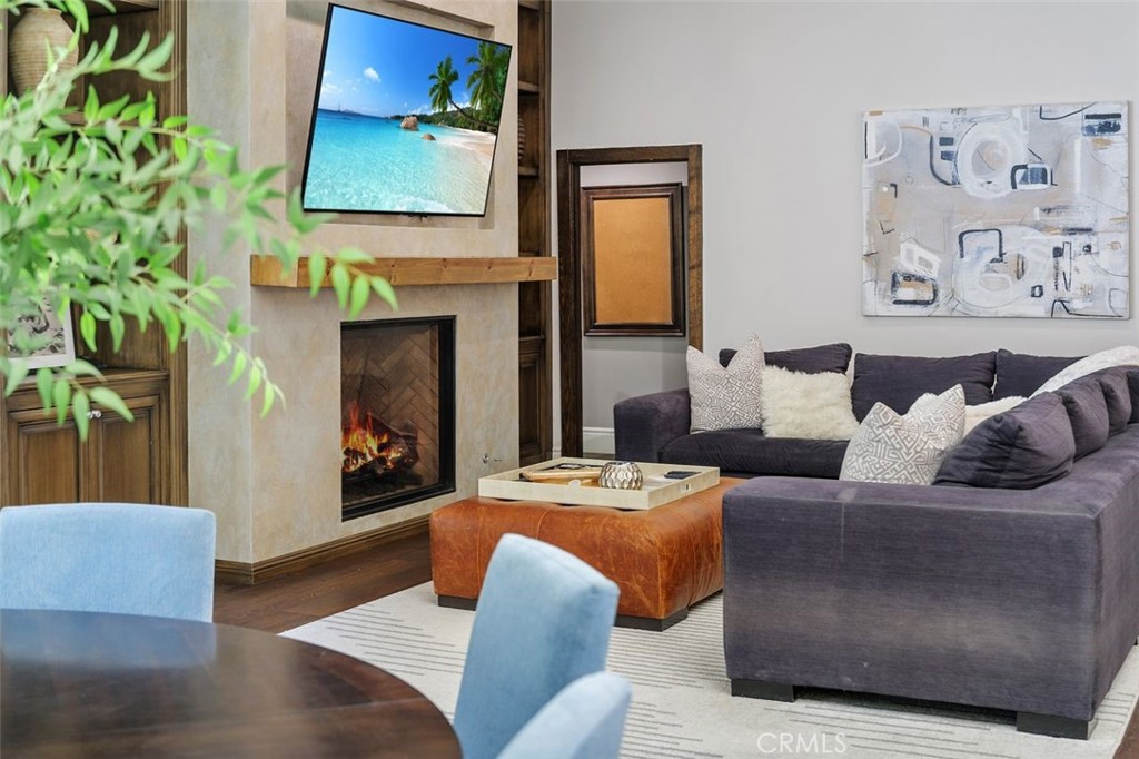 4 Inverness Lane Newport Beach, CA 92660 - Photo 17 of 56 a living room with furniture and a flat screen tv